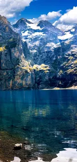 Scenic view of a mountain lake with clear waters and blue sky.