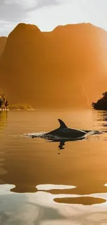 Serene mountain lake with a dolphin at golden sunset.