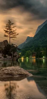 Serene mountain lake at sunset with reflections and forest backdrop.