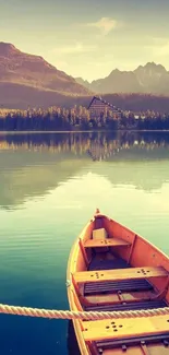 Tranquil boat on serene mountain lake at sunset.