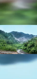 Serene green mountain landscape wallpaper with misty peaks and lush forests.