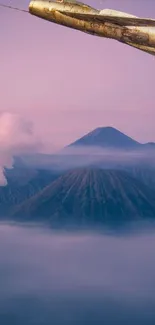 Serene mountain wallpaper with clouds and pastel sky.