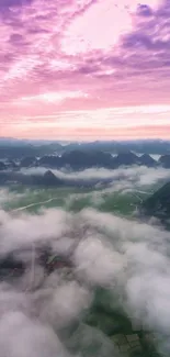 Misty mountain landscape with pink sky and lush greenery.