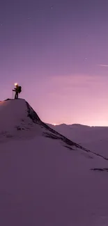 Lone hiker silhouetted against a purple nighttime mountain landscape.