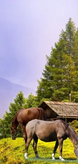 Peaceful mountain scene with grazing horses and lush green trees.