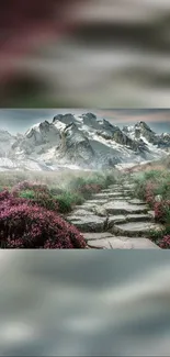 Scenic mountain path with wildflowers under a snowy peak.