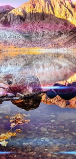 Serene mountain reflected in calm lake with burnt orange hues.