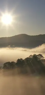 Sunrise over misty mountains with soft sunlight and serene morning atmosphere.