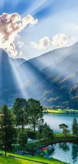 Serene sunrise over a mountain landscape with sunrays and vibrant scenery.