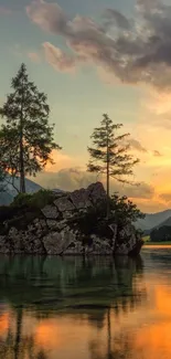 Serene mountain landscape with sunset reflected on tranquil waters.