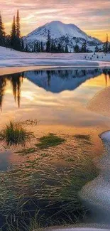 Serene sunset reflecting in snow-capped mountains and calm lake.