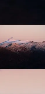 Snow-capped mountain at pink sunset, serene view for mobile wallpaper.