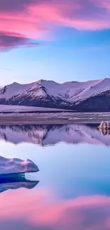 Idyllic mountain sunset with pink clouds reflecting on icy waters.