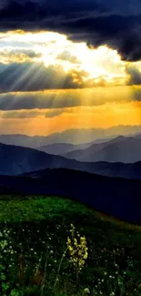 Breathtaking sunset over mountain range with vibrant colors and dramatic clouds.