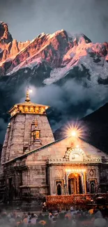 Illuminated mountain temple with misty backdrop.