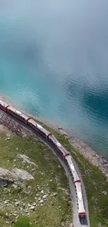 Scenic train journey by turquoise waters in the mountains.