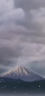 Calm mountain under expansive cloudy skies.