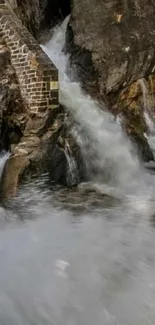 Serene mountain waterfall cascading over rocks.