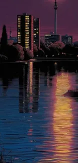 Night cityscape with reflection on water.