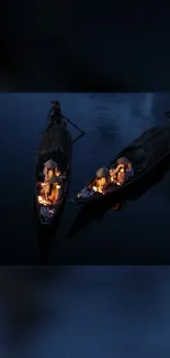 Traditional boats with glowing lanterns on a dark river at night.