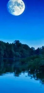 A calm river reflecting a full moon in a blue night sky, surrounded by trees.