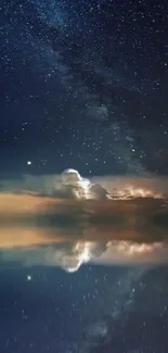 Starry night sky reflecting in calm sea with sailboat.