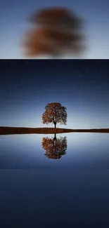 Solitary tree with reflection under starry night sky wallpaper.