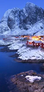 Snowy Nordic coastal scene with blue mountains.