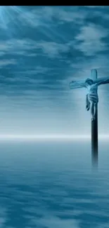 Serene ocean view with crucifix and clouds in blue tones.