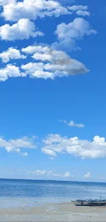 Tranquil ocean under a vast blue sky with scattered clouds