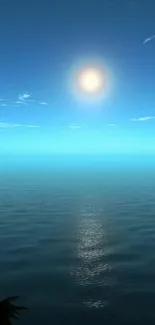 Serene ocean sunrise with blue sky and sun's reflection on the water.