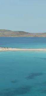 Turquoise ocean and sandy beach landscape wallpaper.