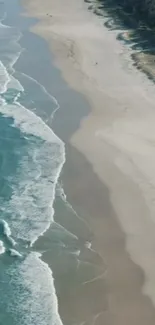 Aerial view of a serene beach with gentle waves and sandy shores.