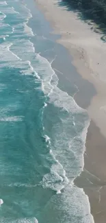 A serene beach with turquoise waves and sandy shores on a mobile wallpaper.