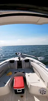 Boat on the ocean with blue sky on a sunny day wallpaper.