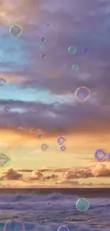 Serene ocean sunset with floating bubbles over vibrant sky.