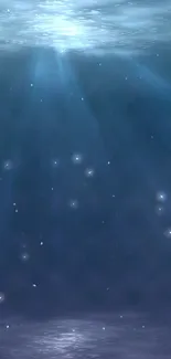 Serene ocean depths wallpaper with light rays penetrating water.
