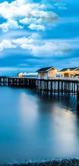 Serene ocean pier with a tranquil blue sky and calm waters.