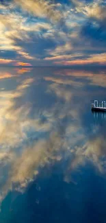 Peaceful ocean with stunning blue sky reflections creating a serene atmosphere.