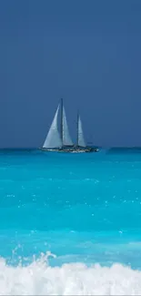 A sailboat gracefully sailing on serene blue ocean waters.