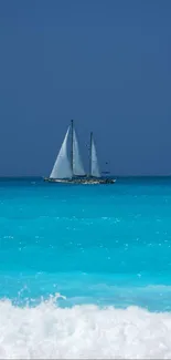 Sailing boat on turquoise water with blue sky.