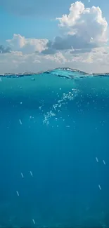 Ocean and sky wallpaper with blue waters and clouds.