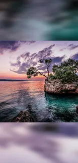 Serene ocean sunset with rocky islet and vibrant sky hues.