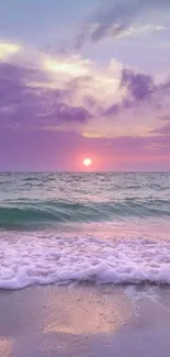 Serene ocean sunset wallpaper with lavender skies and gentle waves.