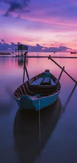 Scenic boat on ocean at sunset with purple and pink skies.