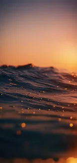 Serene ocean waves at sunset with a warm glow.