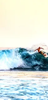 Surfer riding ocean waves under a vibrant sunset sky.