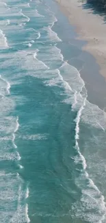 A tranquil mobile wallpaper of ocean waves and a sandy beach.