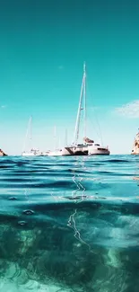 Turquoise ocean with sailboats and coastal cliffs under a clear sky.