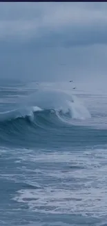 A serene ocean wave against a deep blue sky.